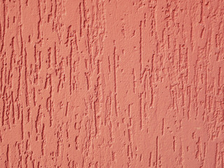 Orange facade close-up. Texture. Injection of paint on the house.