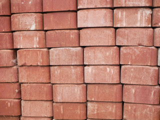 Orange street tile. Stacked tiles in a column. Close-up