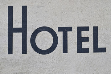 Hotel Sign Painted on White Wall 6343-042