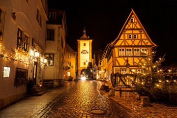 Fototapeta na wymiar ROTHENBURG OB DER TAUBER, GERMANY - DECEMBER 22, 2012: Street View of Rothenburg ob der Tauber on Christmas. It is well known medieval old town, a destination for tourists from around the world