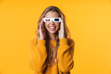 Image of happy blonde woman wearing 3D glasses watching movie