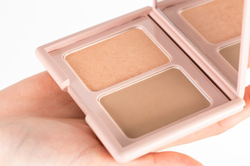 Makeup powder, Retouching powder, to repair highlights and shadows on the face. And mirror
