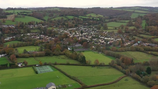 Wide aerial orbit of Dulverton Junior School, located on the River Barle on the edge of Exmoor, UK.