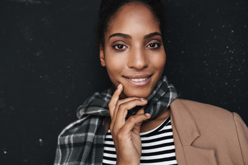 Portrait of african american woman smiling and looking at camera