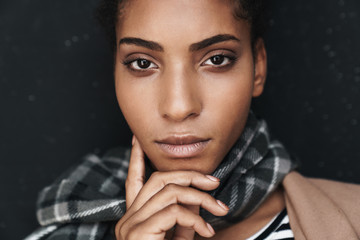 Portrait of african american woman posing and looking at camera