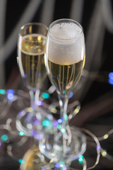 Champagne in two shiny and elegant glass cups