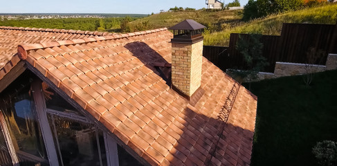 House with ceramic tile roof. cement-sand roof tiles.