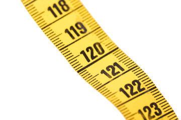 Close-up of a yellow measuring tape isolated on white - 120
