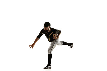 Fototapeta na wymiar Baseball player, pitcher in a black uniform practicing and training isolated on a white background. Young professional sportsman in action and motion. Healthy lifestyle, sport, movement concept.