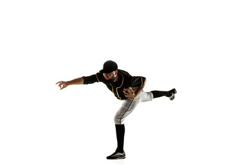 Fototapeta na wymiar Baseball player, pitcher in a black uniform practicing and training isolated on a white background. Young professional sportsman in action and motion. Healthy lifestyle, sport, movement concept.