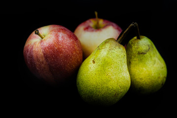  Seasonal fruit on a black background