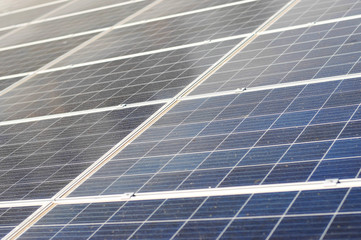 solar panels with sunny sky. Blue solar panels. background of photovoltaic modules for renewable energy.