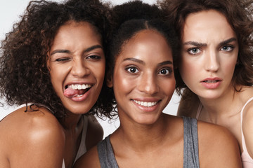 Portrait of multiracial women standing together and looking at camera