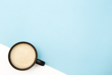 Flatlay coffee on a blue-white background. With copy space