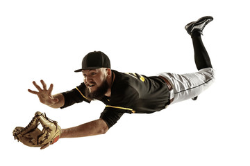 In flight. Baseball player, pitcher in black uniform practicing and training isolated on white...