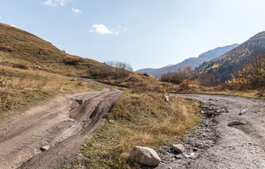 Mountain  road passing between the mountains in Svaneti in the mountainous part of Georgia