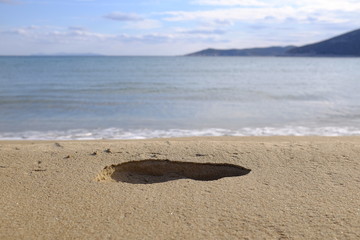 empreinte de pas sur la plage