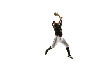 Fototapeta na wymiar In jump. Baseball player, pitcher in black uniform practicing and training isolated on white background. Young professional sportsman in action and motion. Healthy lifestyle, sport, movement concept.