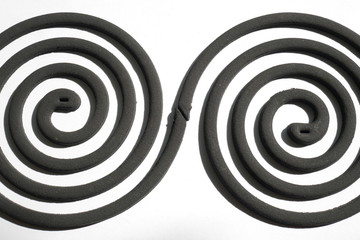 Naklejka premium Mosquito repellent incense coil black on white background