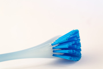 Blue plastic brush for dish isolated on white background. Equipment for cleaning