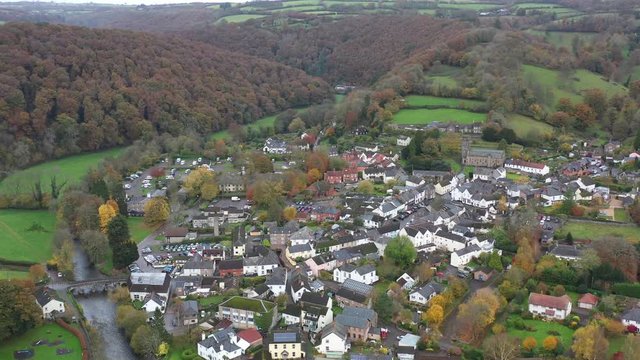 Wide aerial orbit of Dulverton, a small market town located on the River Barle on the edge of Exmoor, UK.