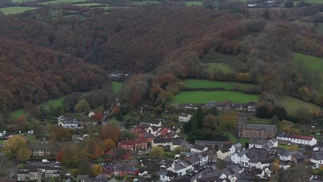 Dolly shot of the dramatic valley surrounding the market town of Dulverton, located on the River Barle on the edge of Exmoor, UK.