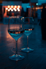 Two white wine glasses, romantic evening for two in Tirana, Albania