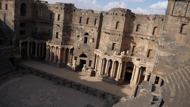 Panning shot, showing the Bosra Amphitheater in Syria.