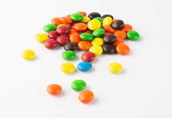 Group of colorful candies over white background.