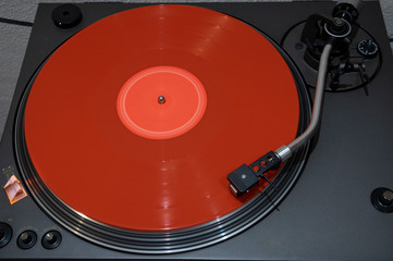 dj turntable old style with coloured red vinyl