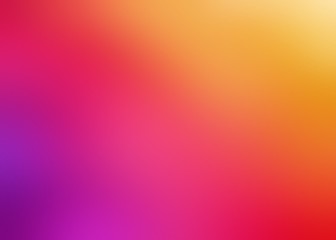 Background blurred gradient of yellow pink red colors. Defocused abstract pattern. 