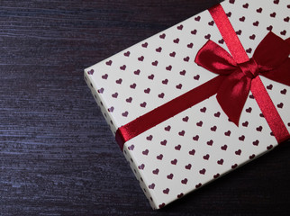 gift box with hearts and red bow