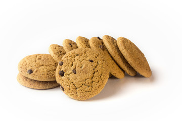 A pile of cookies with chocolate chips on a white isolated background.