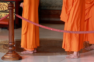 Chinese monks are standing and praying in Chinese temple in Thailand.