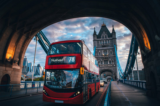 Red double decker bus at the Tower Bridge in London