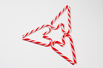 Christmas candy canes in heart shape. Two Christmas candy cans in heart shape. Christmas and...