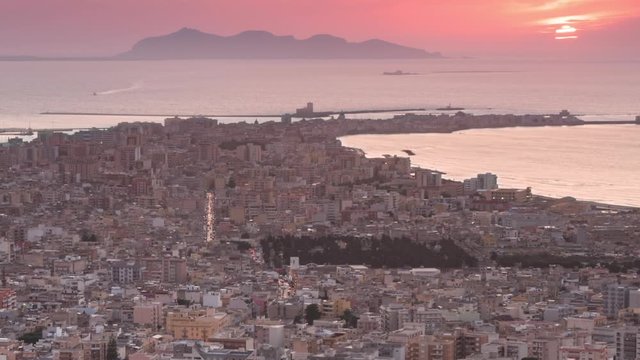 trapani cityscape timelapse from day to night zoom out