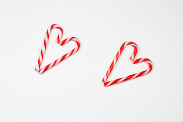 Christmas candy canes in heart shape. Two Christmas candy cans in heart shape. Christmas and Valentin day concept. Part of set. 