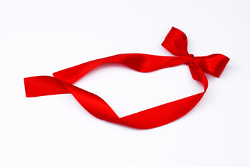 Red ribbon on white background. Satin red ribbon with bow isolated on white. Part of set.