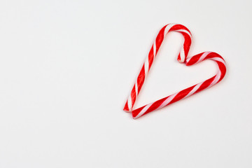 Christmas candy canes in heart shape. Two Christmas candy cans in heart shape. Christmas and Valentin day concept. Part of set. 