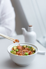 Chirashi Sushi Rice Bowl. Japanese Appetizer with Burnt Salmon, Edamame Soybeans, Avocado and Rice