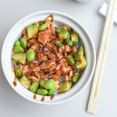 Chirashi Sushi Rice Bowl. Japanese Appetizer with Burnt Salmon, Edamame Soybeans, Avocado and Rice