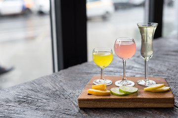 Assorted Homemade Citrus Liqueurs Limoncello Served with Orange, Lime and Lemon Slices