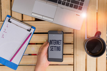Text sign showing Internet Setting. Business photo text etermines how it connects to your wireless carrier for data woman computer smartphone drink mug office supplies technological devices