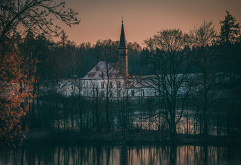 Evening mystical landscape with an ancient castle. Gatchina. Russia.