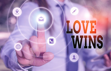 Writing note showing Love Wins. Business concept for used to celebrate or commemorate the victory of marriage equality