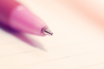 Ballpoint pen on the background of a sheet of paper