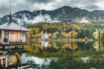 Fototapeta premium Wonderful Foggy sunset over the lake in mountans.