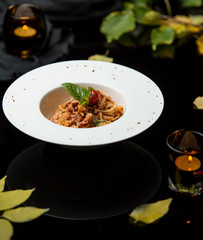 spaghetti in tomato sauce and grated cheese