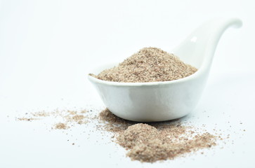 Himalayan black salt or volcanic rock salt on spoon in white background